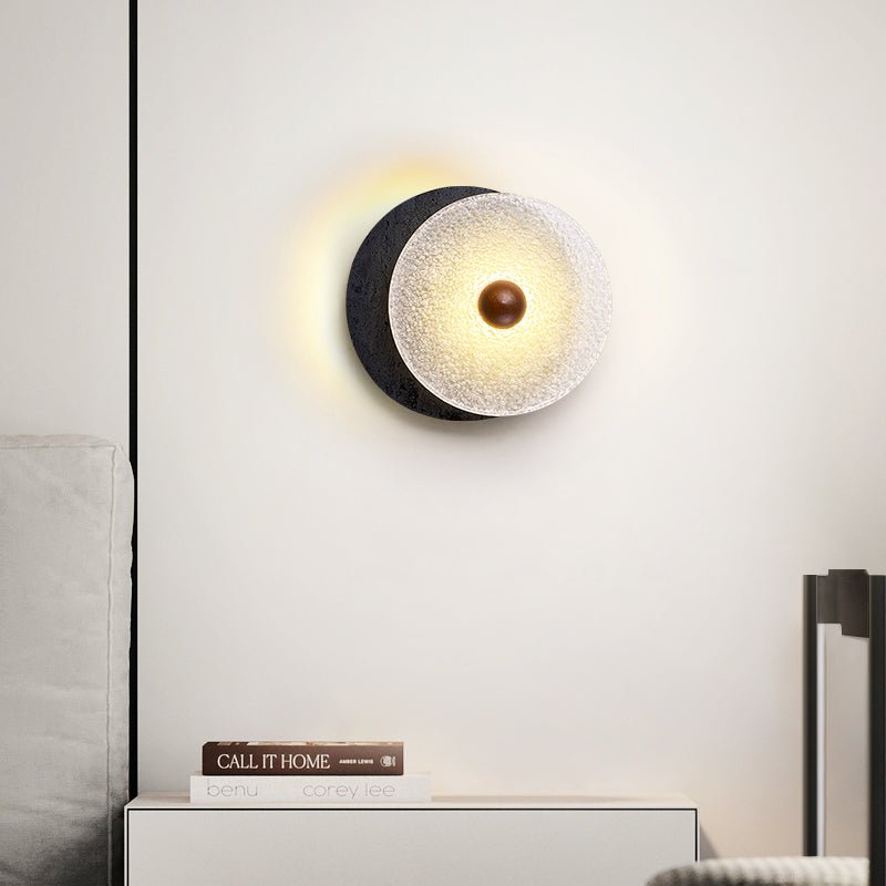 Lunara Textured Disc Wall Sconce in Black Travertine and Frosted Glass