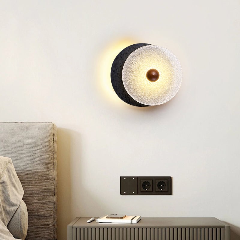 Lunara Textured Disc Wall Sconce in Black Travertine and Frosted Glass