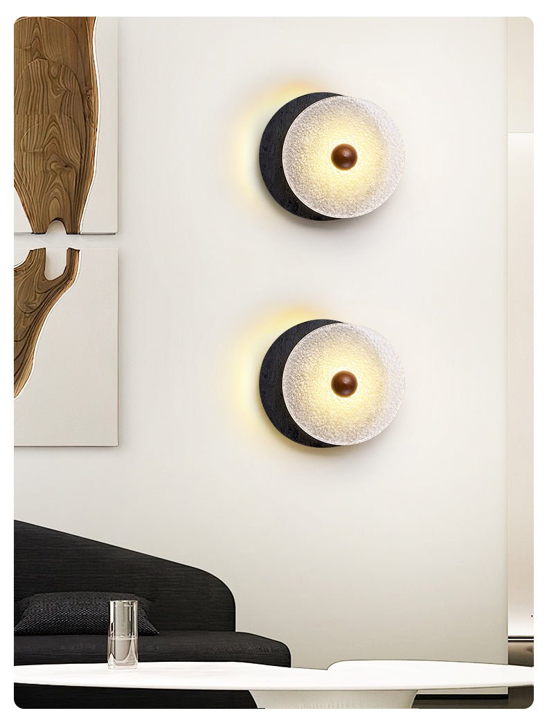 Lunara Textured Disc Wall Sconce in Black Travertine and Frosted Glass