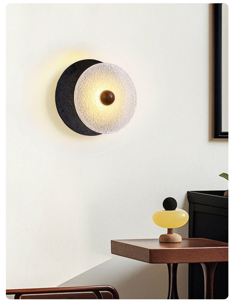 Lunara Textured Disc Wall Sconce in Black Travertine and Frosted Glass