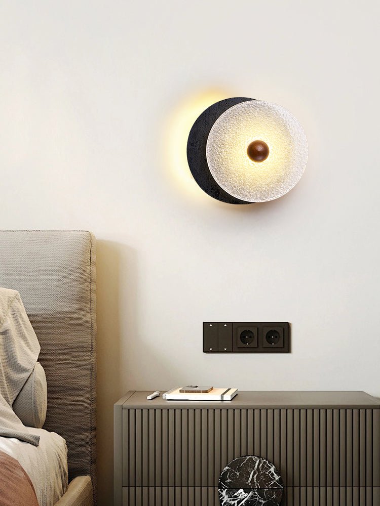 Lunara Textured Disc Wall Sconce in Black Travertine and Frosted Glass
