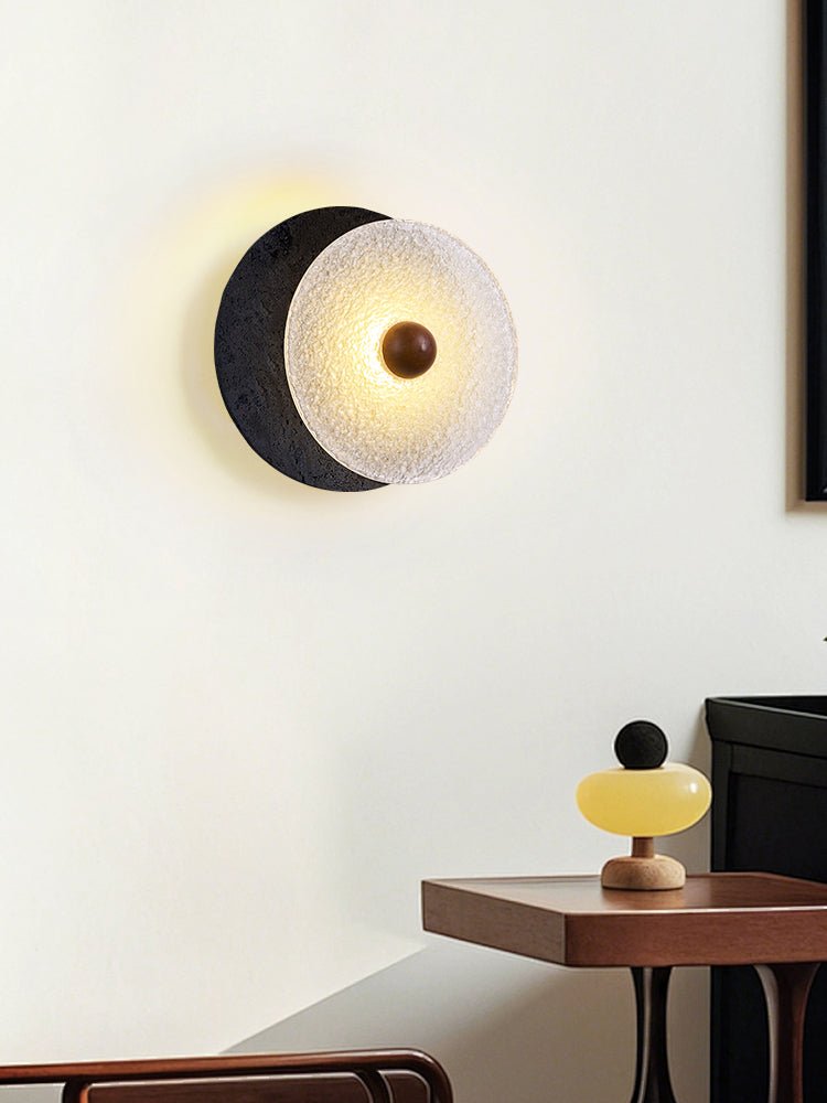Lunara Textured Disc Wall Sconce in Black Travertine and Frosted Glass