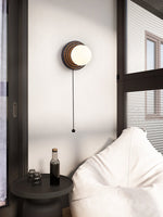 Lunara Black Travertine Wall Sconce with Opal Glass Globe
