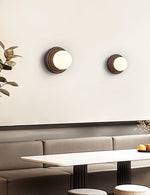 Lunara Black Travertine Wall Sconce with Opal Glass Globe