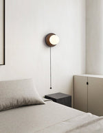 Lunara Black Travertine Wall Sconce with Opal Glass Globe