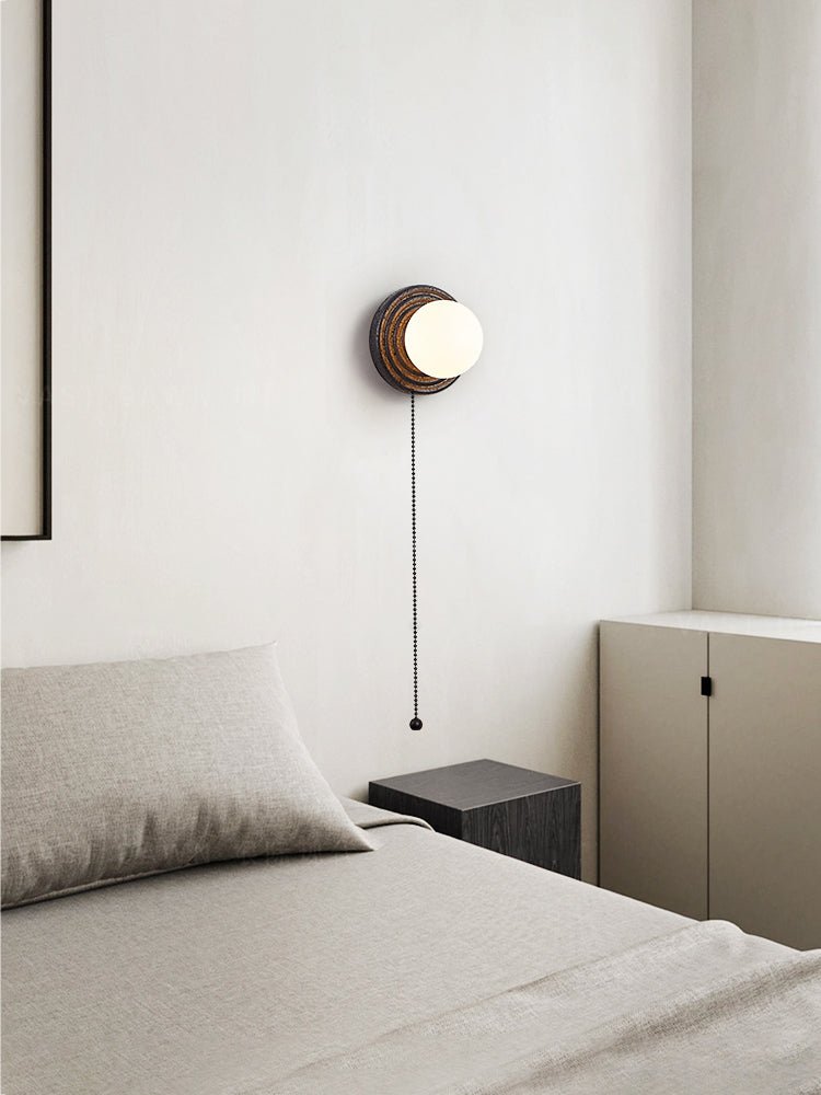 Lunara Black Travertine Wall Sconce with Opal Glass Globe