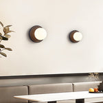 Lunara Black Travertine Wall Sconce with Opal Glass Globe
