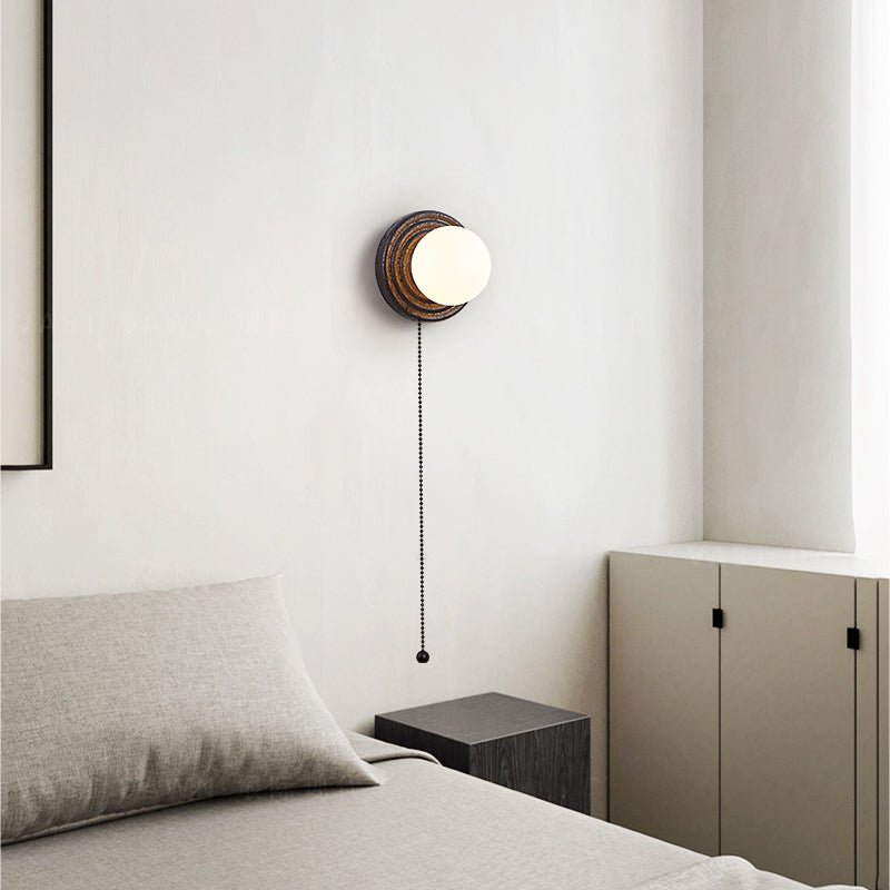 Lunara Black Travertine Wall Sconce with Opal Glass Globe