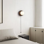 Lunara Black Travertine Wall Sconce with Opal Glass Globe