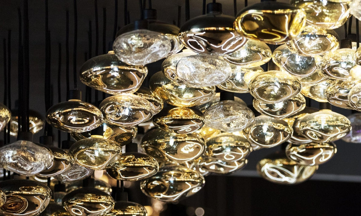 Lure Linear LED Chandelier in Gold and Clear Glass for Modern Interiors