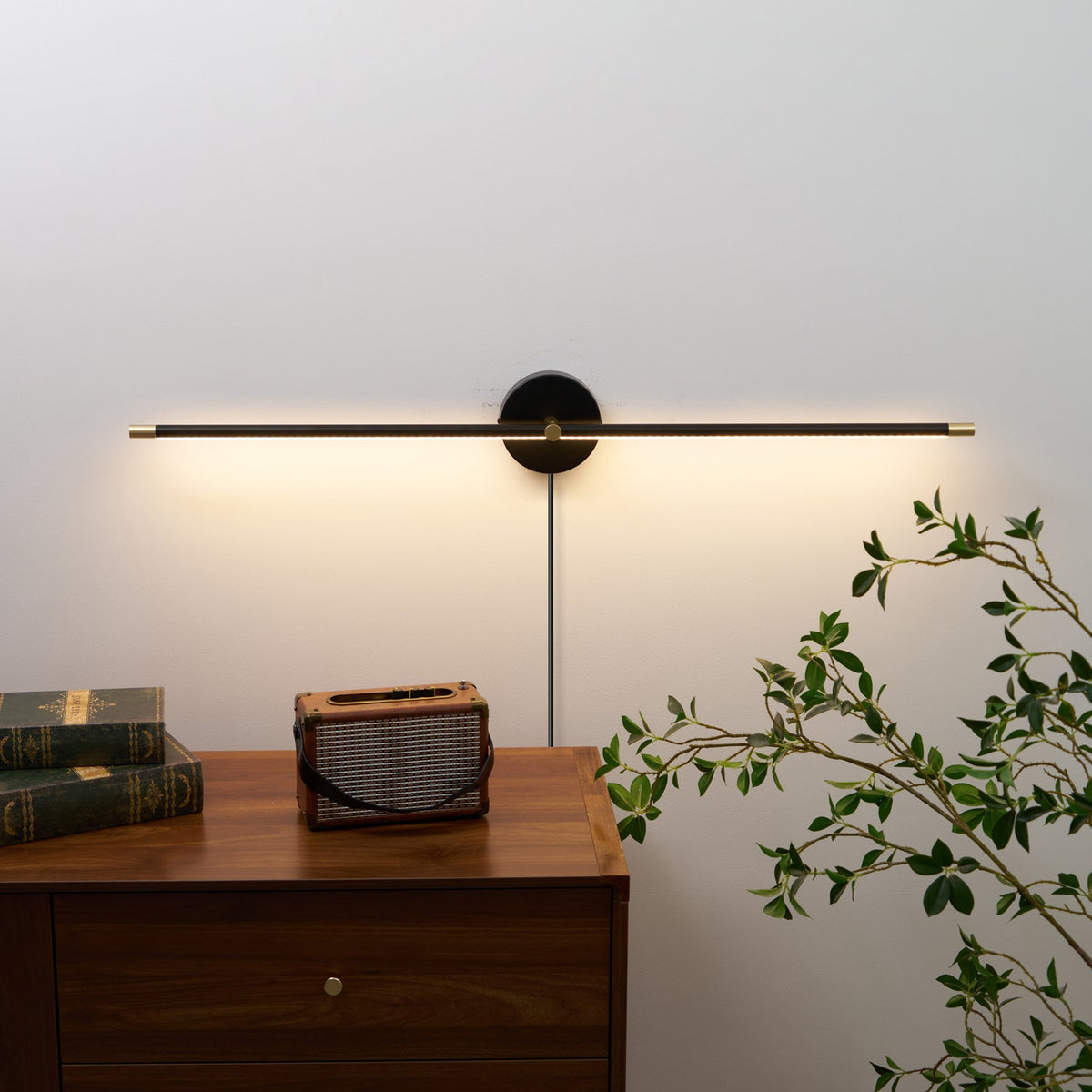 Linear LED Plug-In Wall Sconce with Metal Body and Warm Glow