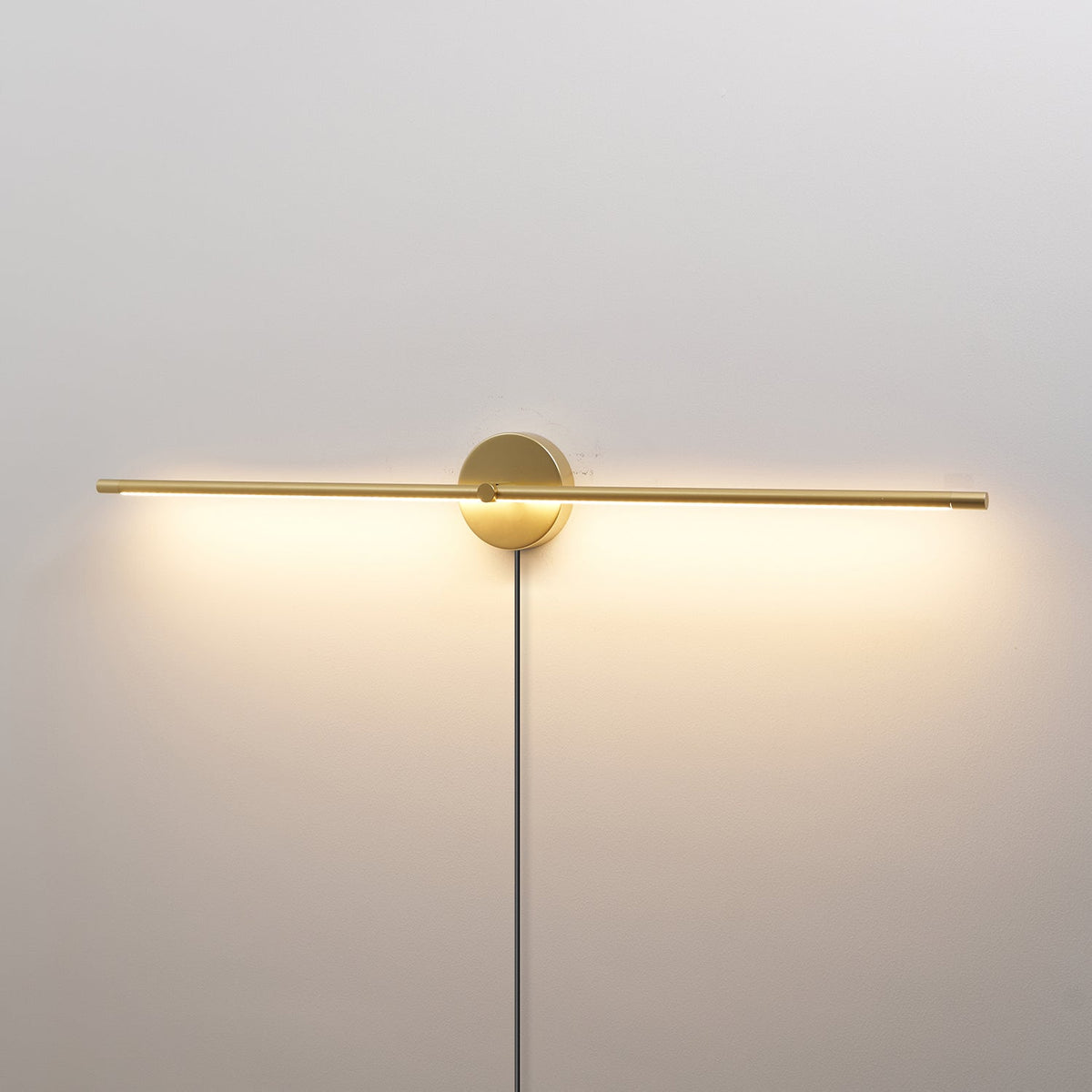 Linear LED Plug-In Wall Sconce with Metal Body and Warm Glow
