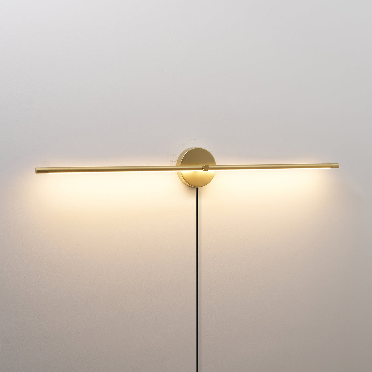 Linear LED Plug-In Wall Sconce with Metal Body and Warm Glow