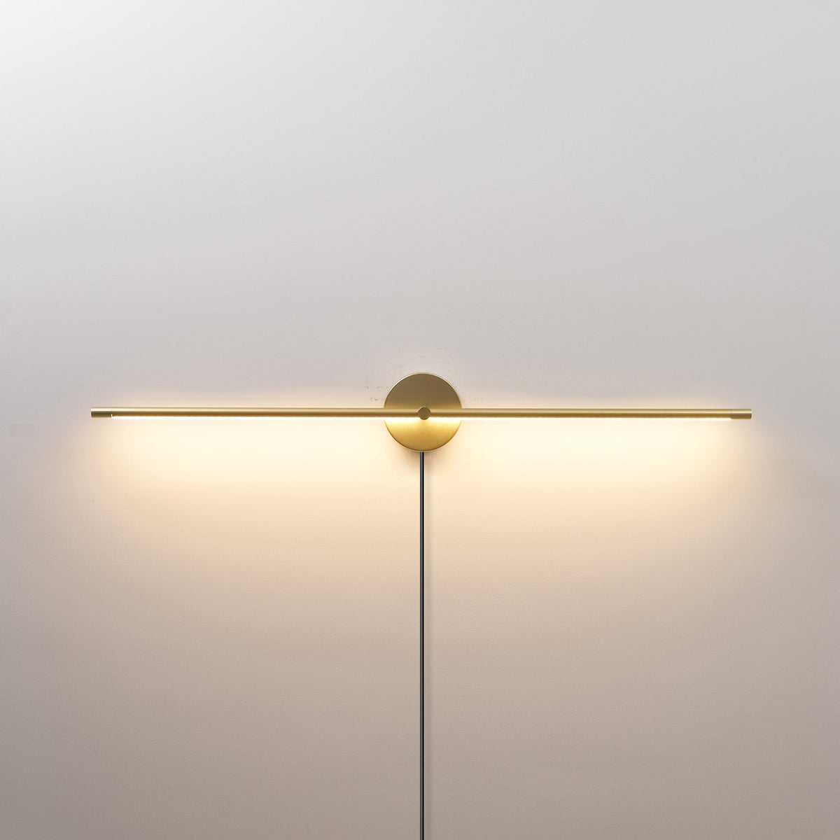 Linear LED Plug-In Wall Sconce with Metal Body and Warm Glow