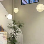 Moon Pendant Lamp – Celestial Resin Hanging Light for Modern Interiors