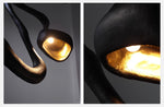Myrrh Sculptural Floor Lamp in Matte Black with Gold Interior
