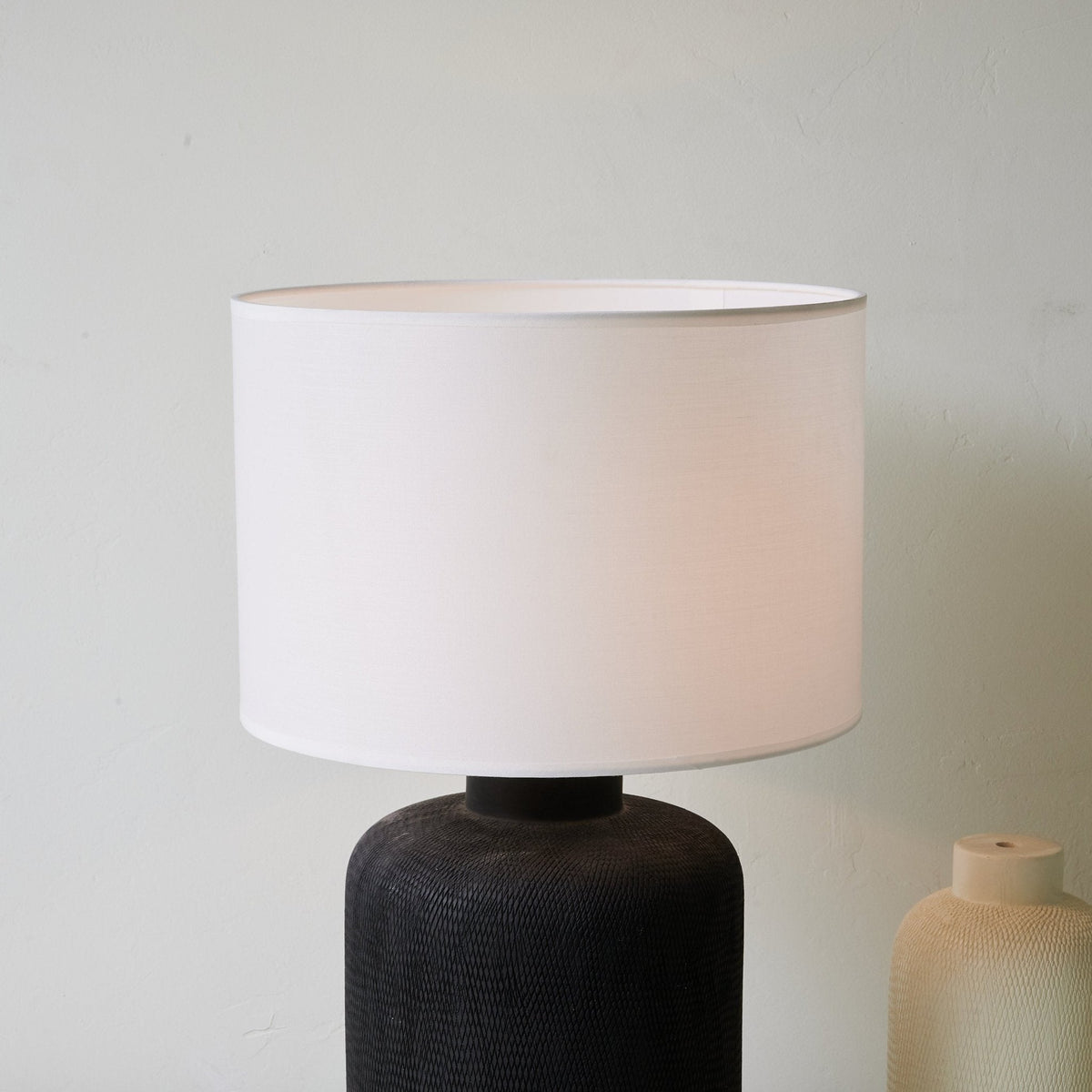 Nocturne Textured Black Ceramic Table Lamp with White Drum Shade