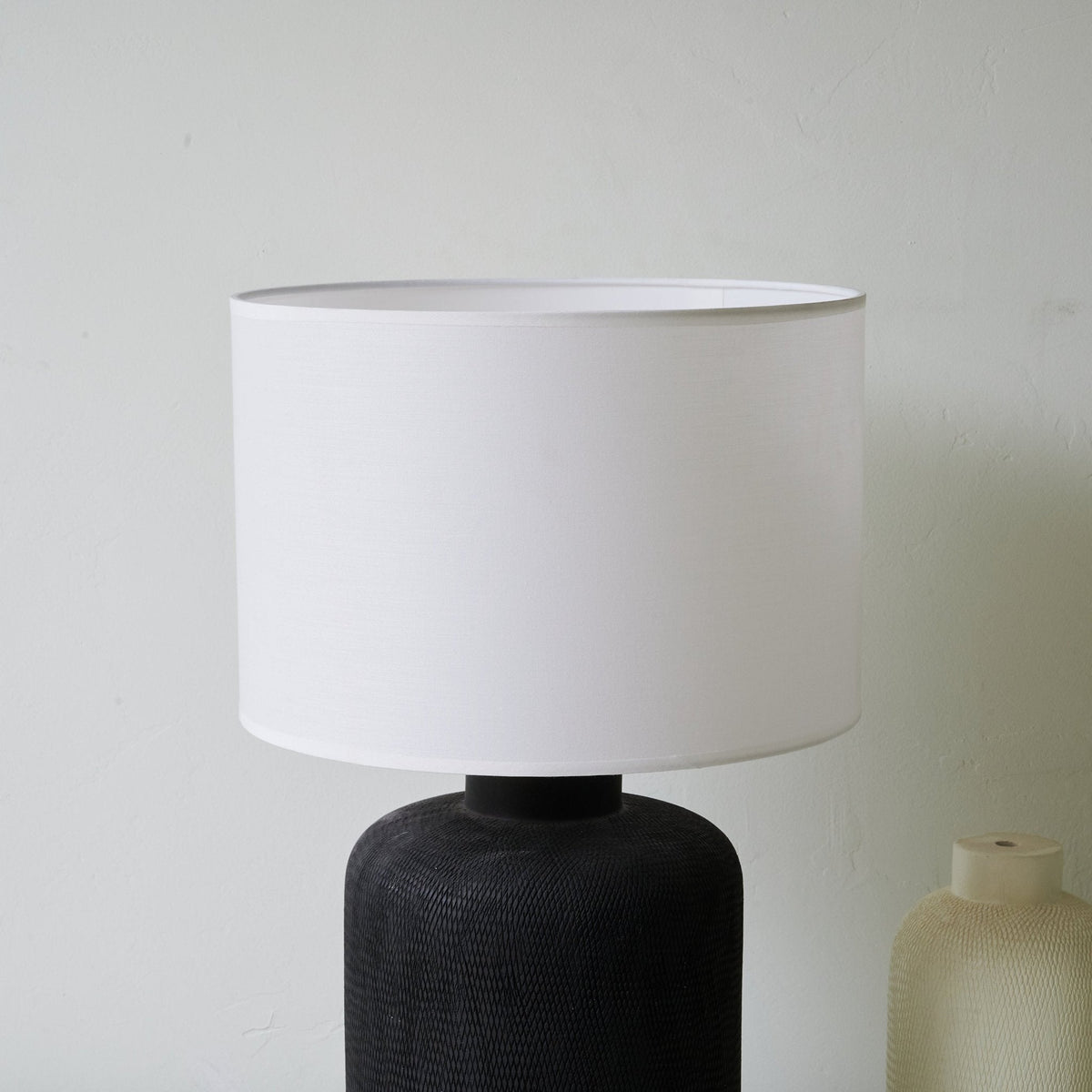 Nocturne Textured Black Ceramic Table Lamp with White Drum Shade