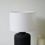 Nocturne Textured Black Ceramic Table Lamp with White Drum Shade