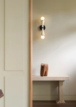 Obel Wall Sconce in Yellow Travertine with Opal Glass Globes