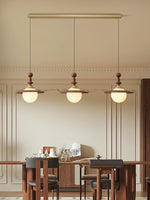 Orben Globe Pendant Light in Gold and Walnut with Opal Glass Shade