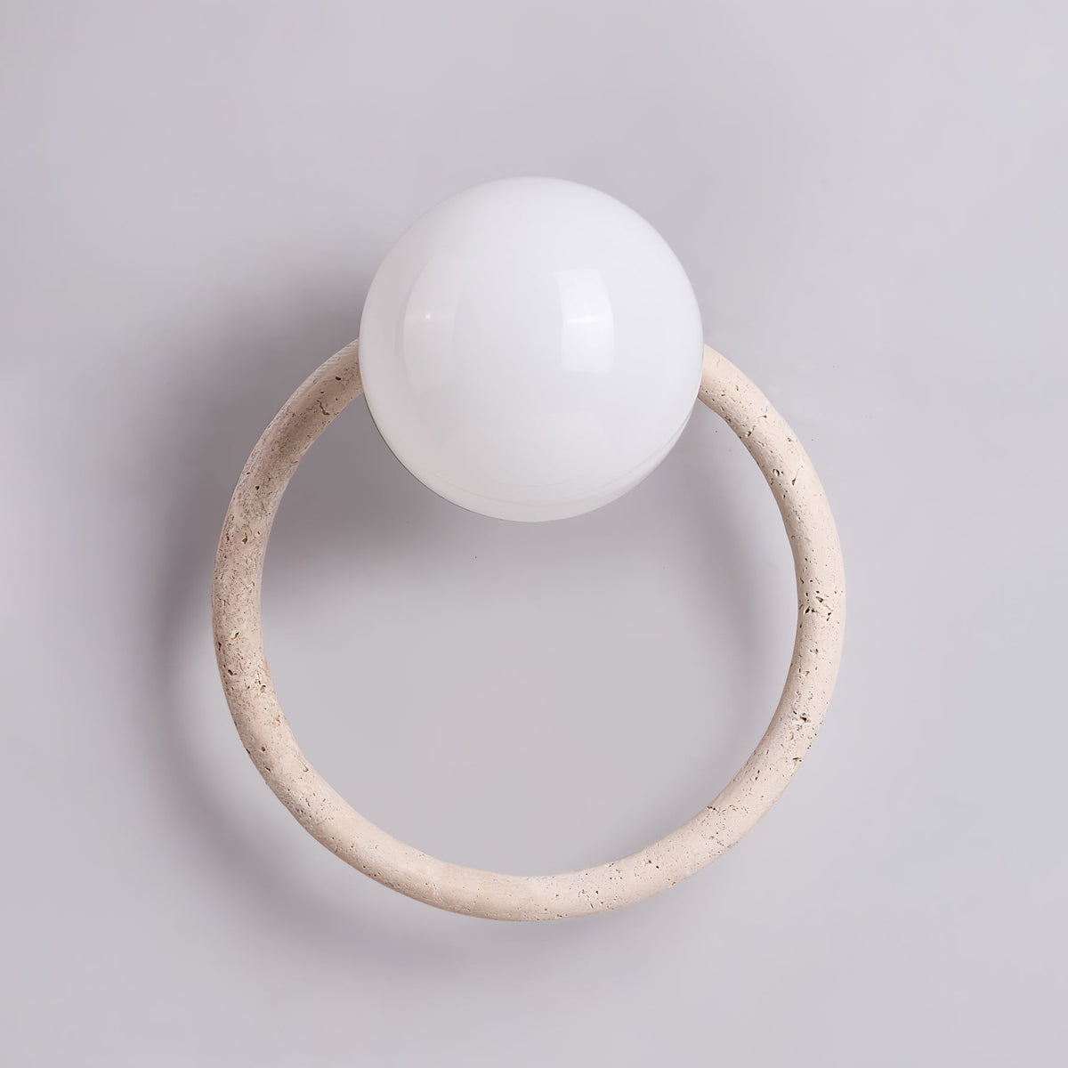 Orria Travertine Wall Sconce with Opaline Glass Globe