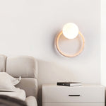 Orria Travertine Wall Sconce with Opaline Glass Globe