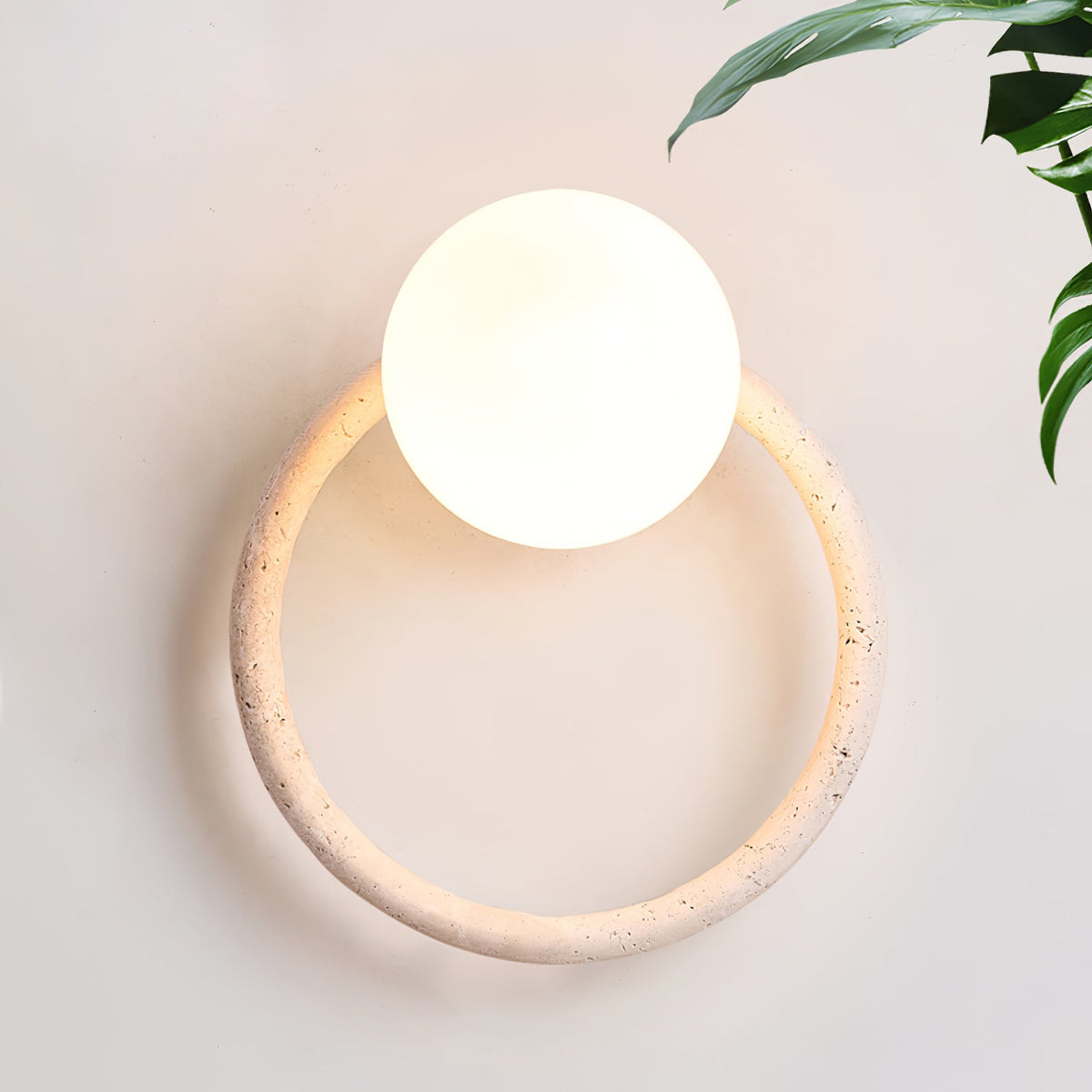 Orria Travertine Wall Sconce with Opaline Glass Globe