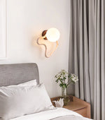Serpentine Travertine Wall Sconce — Modern Organic Lighting for Hallways & Living Spaces
