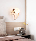 Serpentine Travertine Wall Sconce — Modern Organic Lighting for Hallways & Living Spaces
