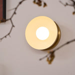 Solar Eclipse Brass Wall Sconce with Glass Shade for Modern Interiors