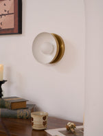 Solar Eclipse Brass Wall Sconce with Glass Shade for Modern Interiors