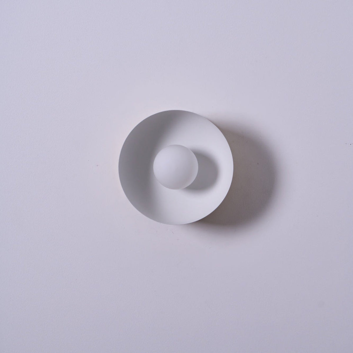 Solar Eclipse Brass Wall Sconce with Glass Shade for Modern Interiors