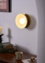 Solar Eclipse Brass Wall Sconce with Glass Shade for Modern Interiors