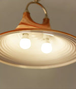 Solari Swirl Glass Pendant Light – Hand-Blown Amber Art Glass