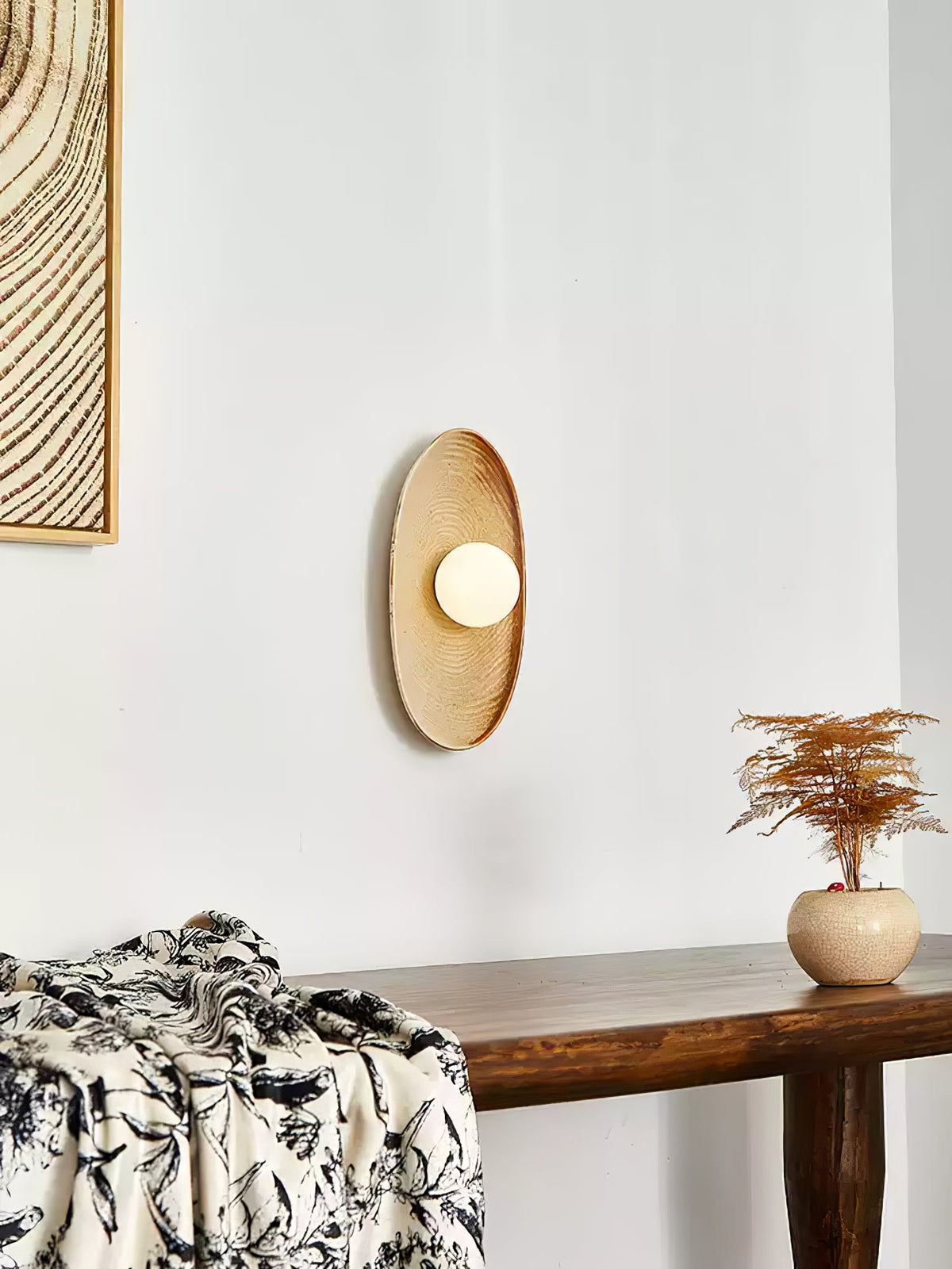 Solstice Swirl Ceramic Wall Sconce with Glowing Orb