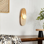 Solstice Swirl Ceramic Wall Sconce with Glowing Orb