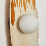 Solstice Swirl Ceramic Wall Sconce with Glowing Orb