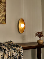 Solstice Swirl Ceramic Wall Sconce with Glowing Orb