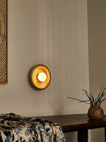 Solstice Swirl Ceramic Wall Sconce with Glowing Orb