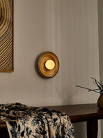 Solstice Swirl Ceramic Wall Sconce with Glowing Orb