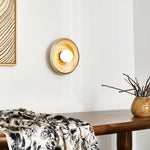 Solstice Swirl Ceramic Wall Sconce with Glowing Orb