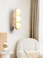 Solstice Trio Wall Sconce in Travertine and Wood – Modern Ambient Lighting