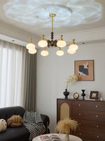 Solviento Modern Brass and Wood Chandelier with Glass Globes