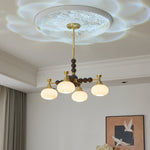 Solviento Modern Brass and Wood Chandelier with Glass Globes