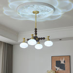 Solviento Modern Brass and Wood Chandelier with Glass Globes