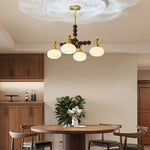 Solviento Modern Brass and Wood Chandelier with Glass Globes