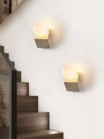 Tavian Orb Travertine Wall Sconce with Glass Globe