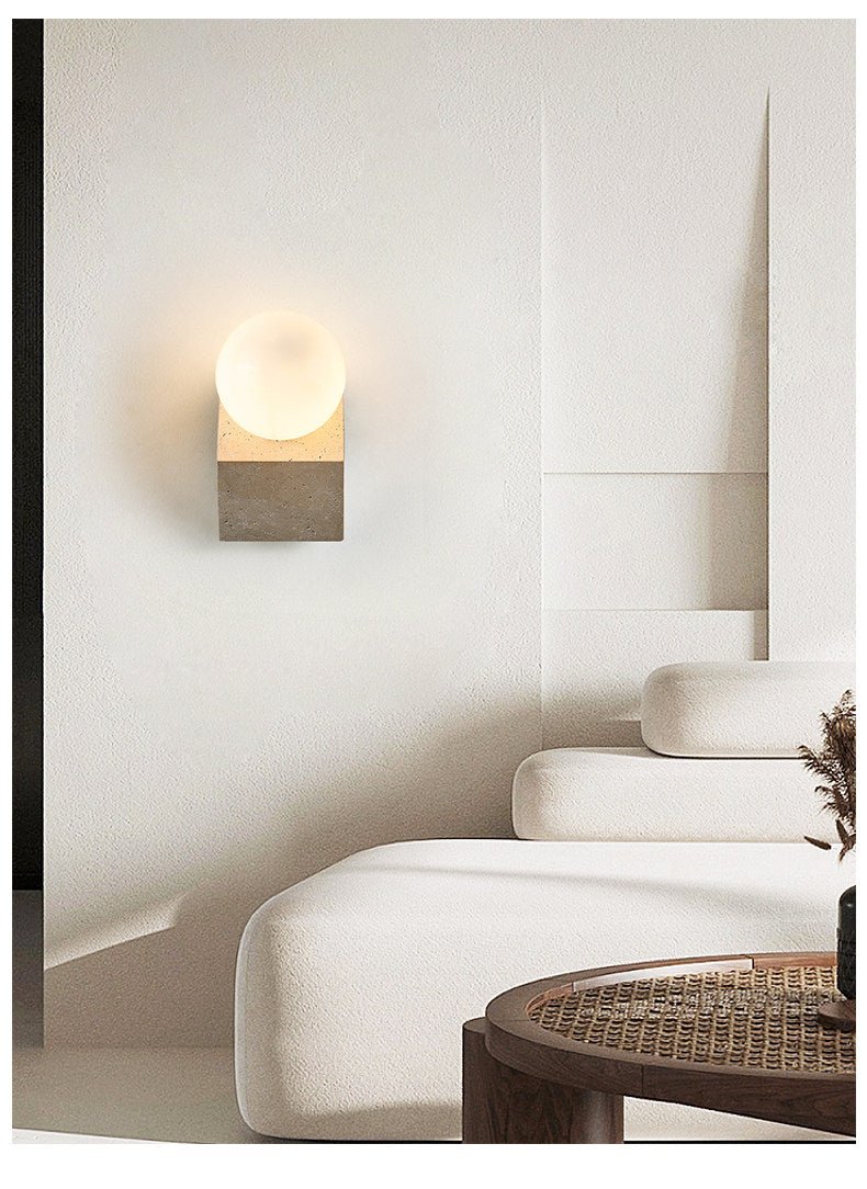 Tavian Orb Travertine Wall Sconce with Glass Globe