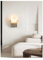 Tavian Orb Travertine Wall Sconce with Glass Globe